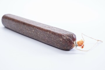 Jerky on a white background. Close-up of basturma sliced into pieces.