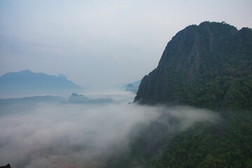 Sunrise over the smoged rice fields taken from Pha Ngern view point near Vang Vieng, Laos, Asia