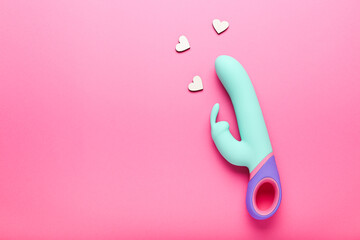 multi-colored sex toy, adult toy on a pink background - obrazy, fototapety, plakaty