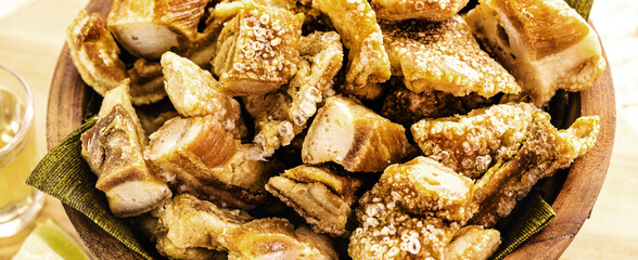 pork, fried and crispy pork belly, typical Brazilian appetizer, traditional food from Minas Gerais