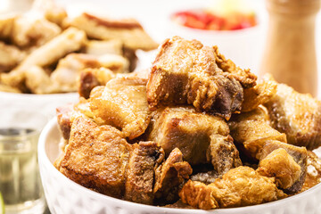 Crackling bowl, Brazilian appetizer made by frying bacon, leather or meat and lots of fat, taken from the pork belly.