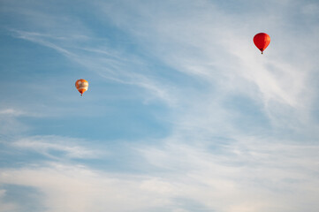 Colorful hot air balloons in blue sky