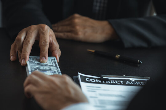 Individuals are giving bribes to officials in order to commit corruption in lawsuits, illegal actions by law enforcement by paying bribes to officials are illegal and unlawful. Fraud concept.