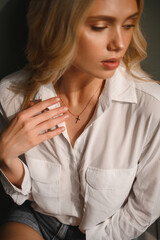 Delicate and sensual blonde in a white silk blouse and with a decoration around her neck - 514057070