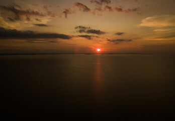 Aerial drone shot of sunset scenery at the sea in Besar Island, Mersing, Johor, Malaysia
