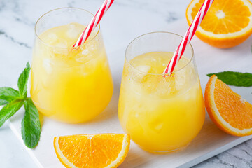 Glass of orange juice with ice. Cold orange fresh