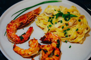 Pasta with shrimps and langustine. Seafood. Home cooking.