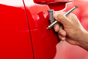 Professional micro paint on an automobile using an airbrush