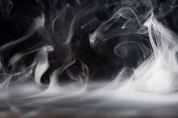 Abstract smoke on a dark background . Isolated .