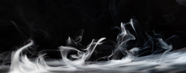 Abstract smoke on a dark background . Isolated .