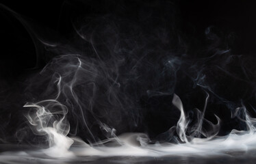 Abstract smoke on a dark background . Isolated .