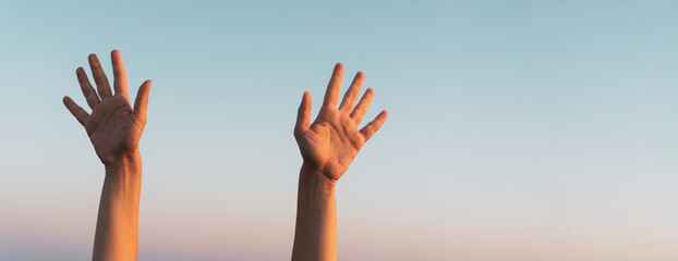 Woman hands showing or doing number ten gesture on blue summer sky background. Counting down, ten...