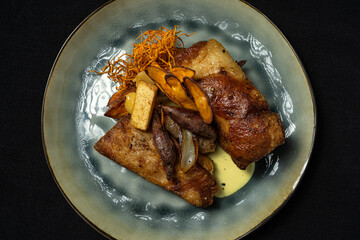 pork rinds with sour sauce, potato chips, cooked onion and sweet potato