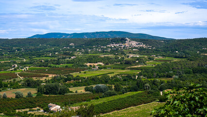 Fototapeta na wymiar Villages dot the French countryside - Luberon region of Provence in the summer
