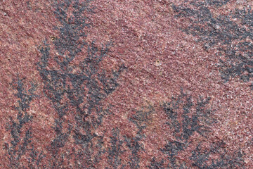 Textura de pared de piedra natural color rojo y negro