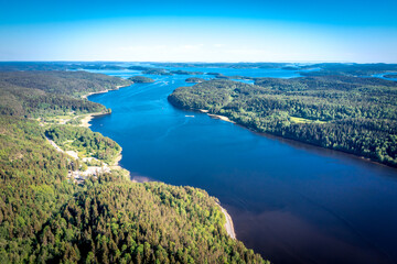 Aerial view on Ladoga lake. Ladoga Lake in Karelia in summer. Blue lake and green forest top view