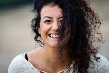 Laughing woman with curly hair