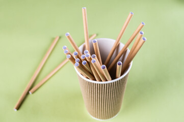Eco friendly Reusable Straw. Paper cocktail tubes. Kraft paper straw for drinking coffee or tea. Disposable cocktail tube. Zero waste concept.