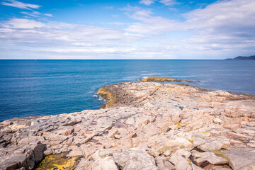 Fototapeta premium Summer tundra. Rocky coastline of Barents Sea near Teriberka, panoramic aerial view. Scenery of Russian North. Kola Peninsula, Murmansk Oblast, Russia