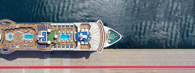 Aerial drone ultra wide photo with copy space of crowded cruise liner ship with pool facilities...