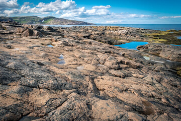 Summer tundra. Rocky coastline of Barents Sea near Teriberka, panoramic aerial view. Scenery of Russian North. Kola Peninsula, Murmansk Oblast, Russia