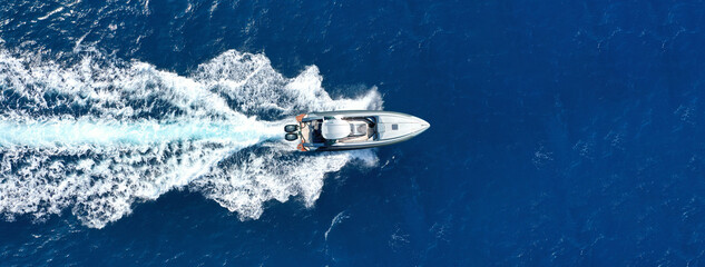 Aerial drone photo of  luxury inflatable rib speed boat cruising in mediterranean deep blue sea