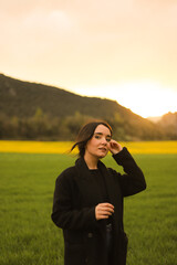 portrait of a young woman smiling in the field