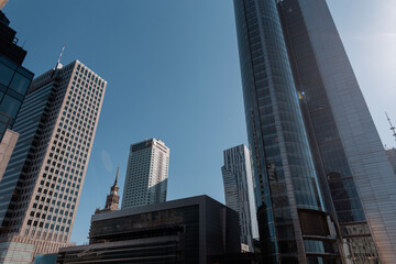 Urban modern city with glasses business and finance buildings with blue sky. Warszawa, Poland. - obrazy, fototapety, plakaty