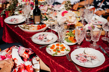 holiday table for birthday, wedding, anniversary. A variety of dishes, fruits, vegetables on the table.