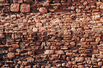 old ancient stone wall corner close up details, seaview on background, coast castle or fortress