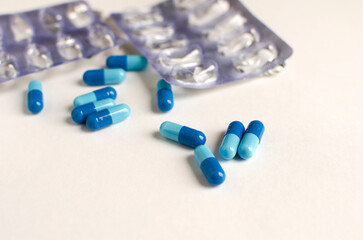 pills scattered on a white background