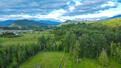 Town in Distance Under Cloudy Sky