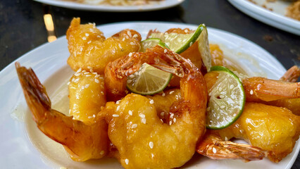 Batter fried sesame prawns with lime