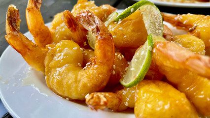 Batter fried sesame prawns with lime