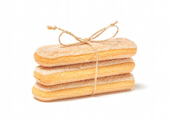 Stack of ladyfingers or savoiardi biscuits cookies tied with a rope, italian dessert, isolated on...