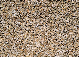 Gravel marble stones for the construction industry. Light stone texture pebble background.