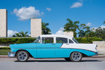 babyblue and white classic car on the streets of cuba