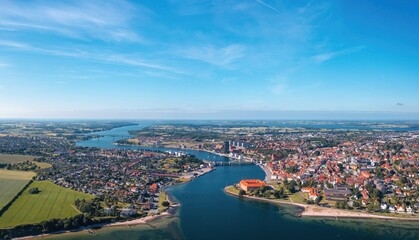 Fototapeta na wymiar Sonderborg (Sønderborg, Denmark) skyline on sunny summer day. Wide aerial panorama