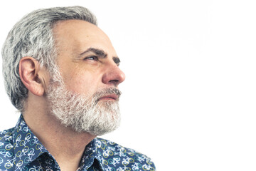 thoughtful senior Caucasian man looking away closeup copy space isolated studio shot . High quality...