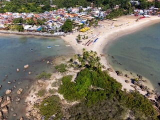 Fototapeta na wymiar Drone top view of beautiful stretch of beach with mangrove vegetation and coconut trees - Morro de São Paulo, Bahia, Brazil