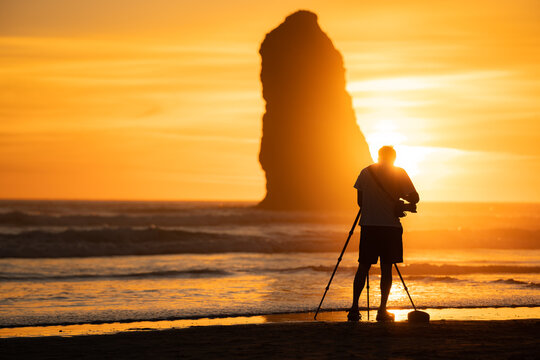 silhouette of a photographer at sunset