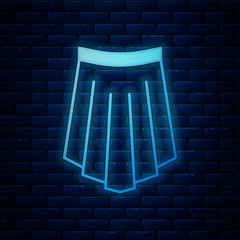 Glowing neon Skirt icon isolated on brick wall background. Vector