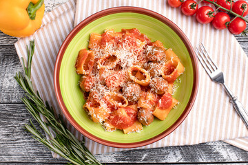 Pasta with meat balls, pasta with tomatoes and meat on a white wooden background, top view