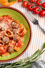 Pasta with meat balls, pasta with tomatoes and meat on a white wooden background, top view