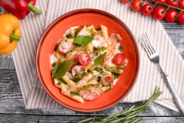 Pasta with salmon, pasta with fish on a white wooden background, top view