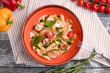 Pasta with salmon, pasta with fish on a white wooden background, top view