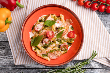 Pasta with salmon, pasta with fish on a white wooden background, top view