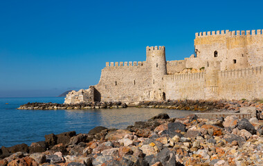 Fototapeta na wymiar Tower and walls of Mamure kalesi, Mersin Province, Turkey. Castle on Mediterranean coast.