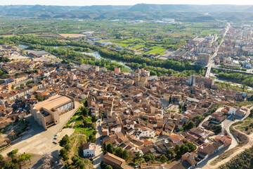 Fototapeta na wymiar Aerial townscape of Fraga with view of Cinca River. Comarca of Bajo Cinca, province of Huesca, Aragon, Spain.