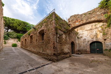 Inside the fortified walls of the historic New Fortress or Fortezza Nuevo in the New Venice canal area of Livorno, Italy. - obrazy, fototapety, plakaty
